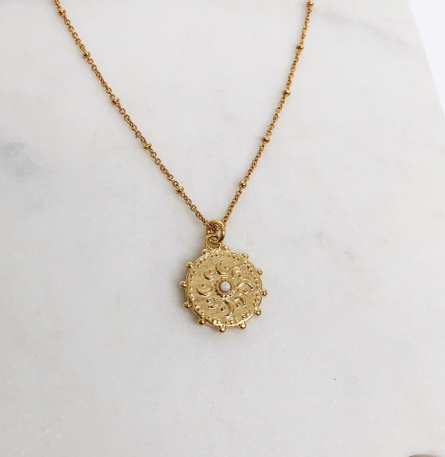 Gold medallion necklace