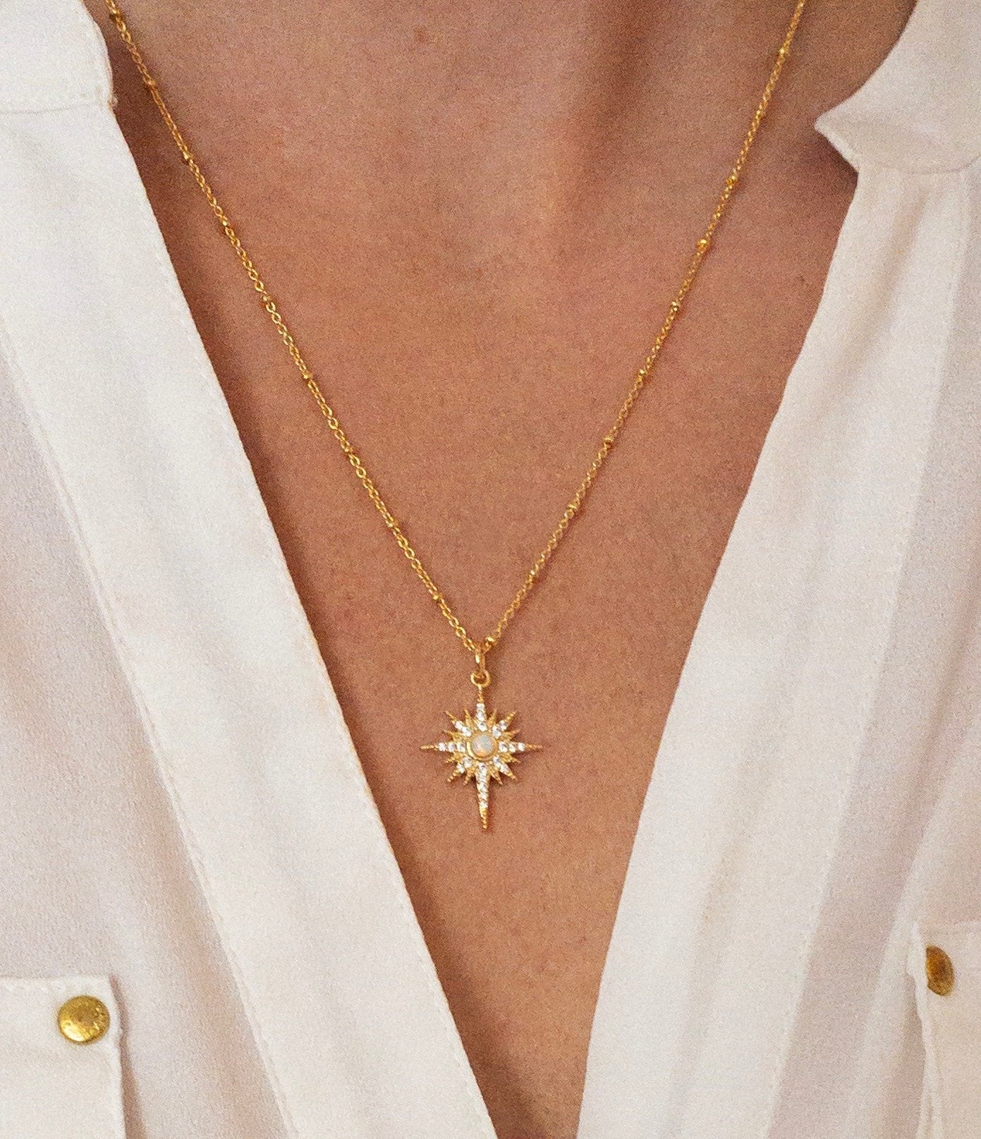 Gold opal star necklace