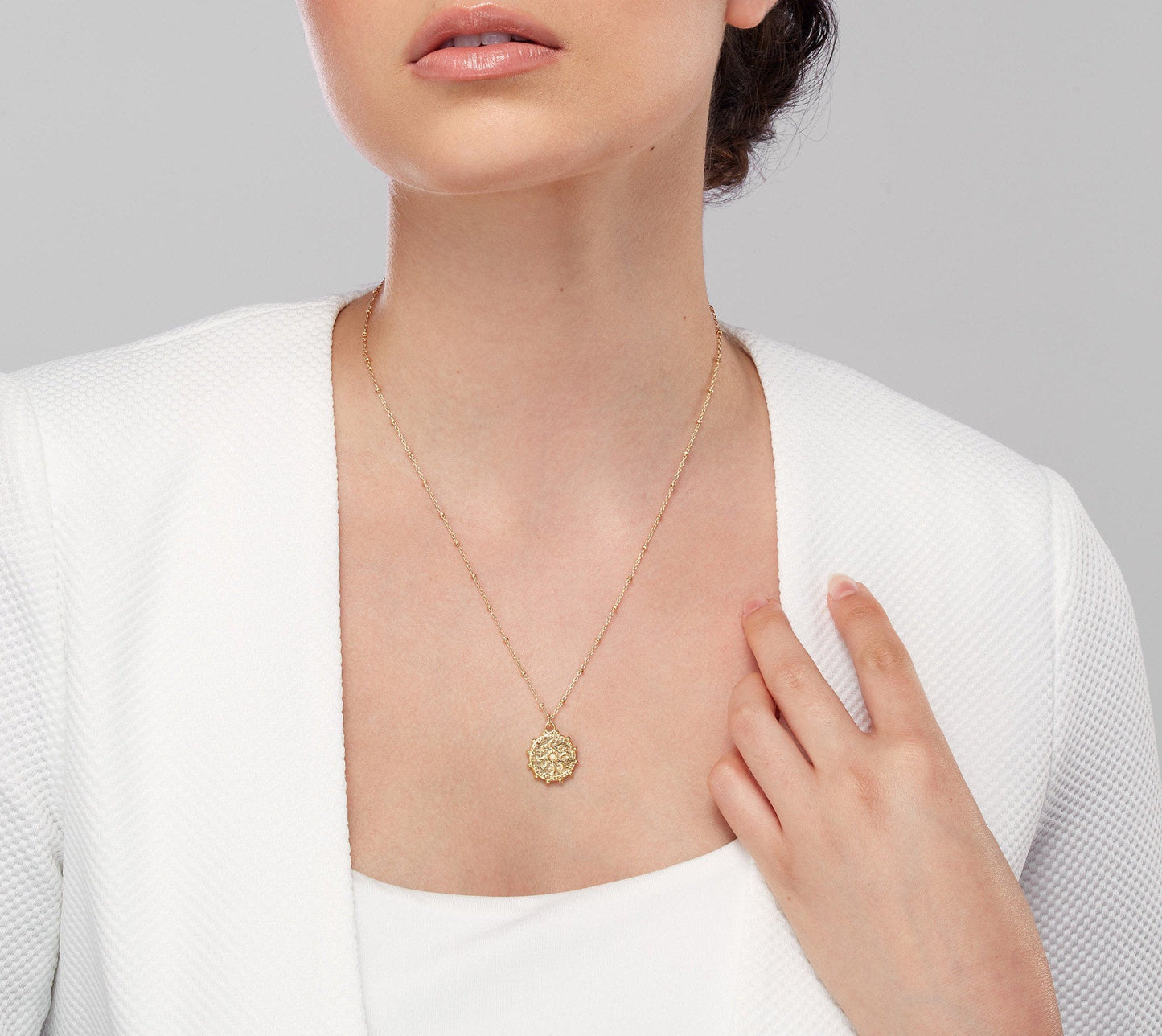 Gold medallion necklace