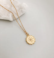 Gold medallion necklace